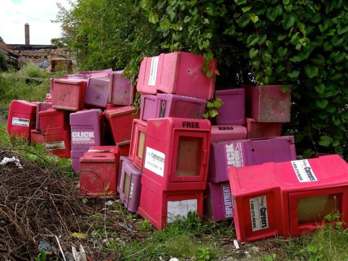 Dozens of employment publication boxes illegally dumped near Detroit River