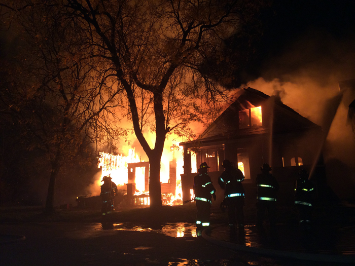 Fire tore through two houses at Mt. Elliot and E. Warren. Photo by Matt Sukkar
