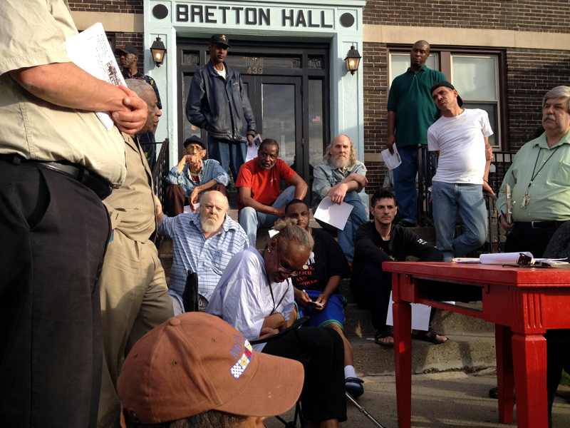 Residents of three apartment buildings on Henry Street gathered after the tenants were ordered to leave.  