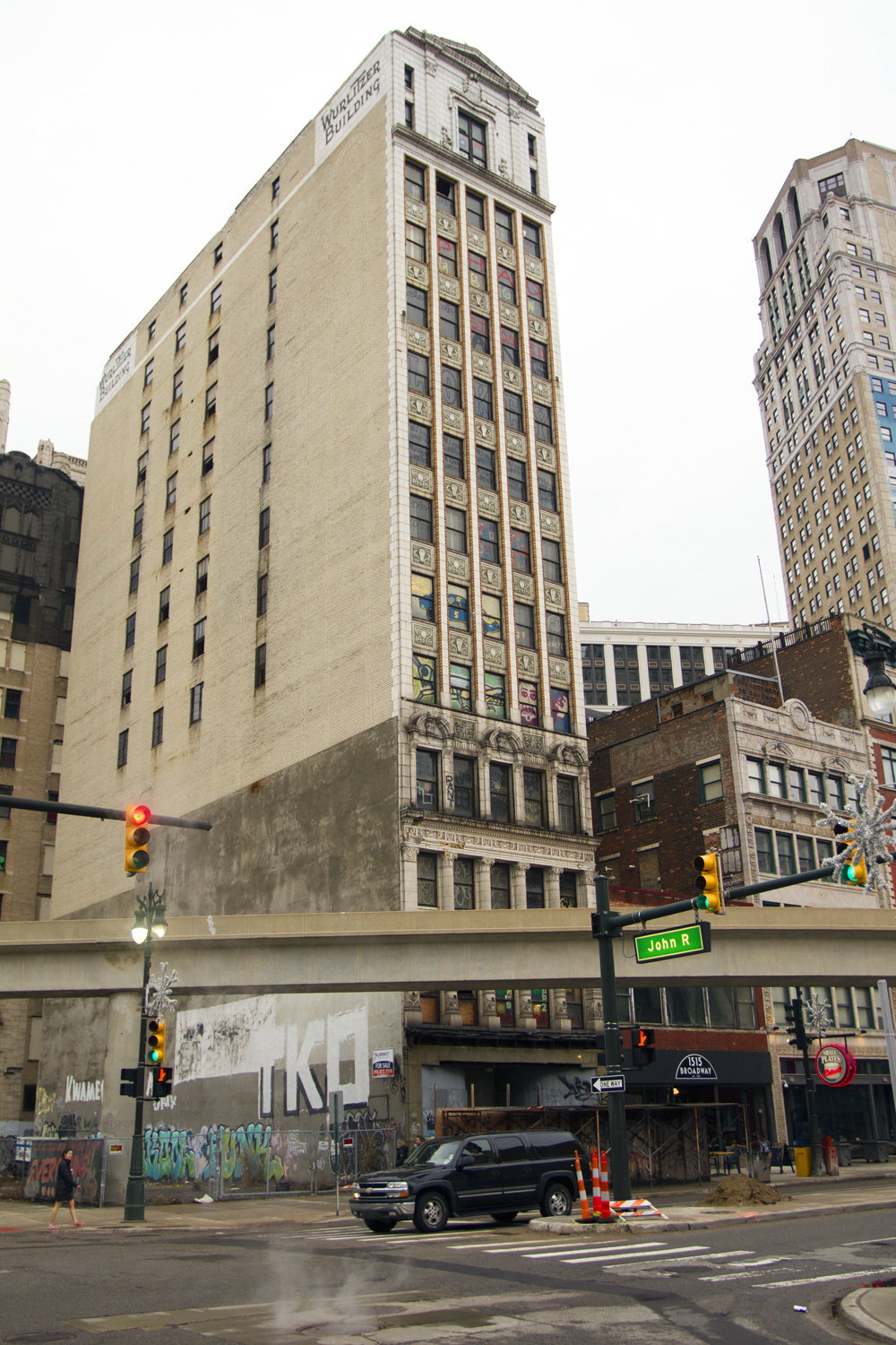 The Wurlitzer is tall and narrow, towering over Broadway. 