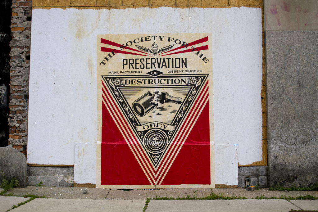 A Fairey mural posted on the CPA Building on Michigan Avenue across from the Michigan Central Station.  
