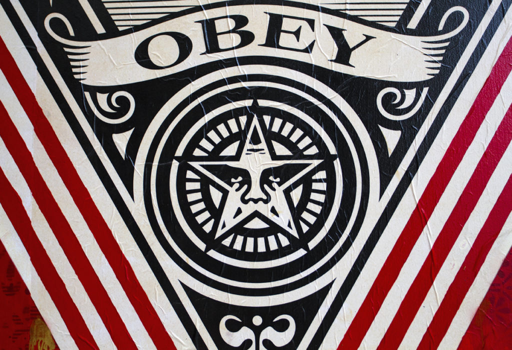 Close-up of an Obey mural. 