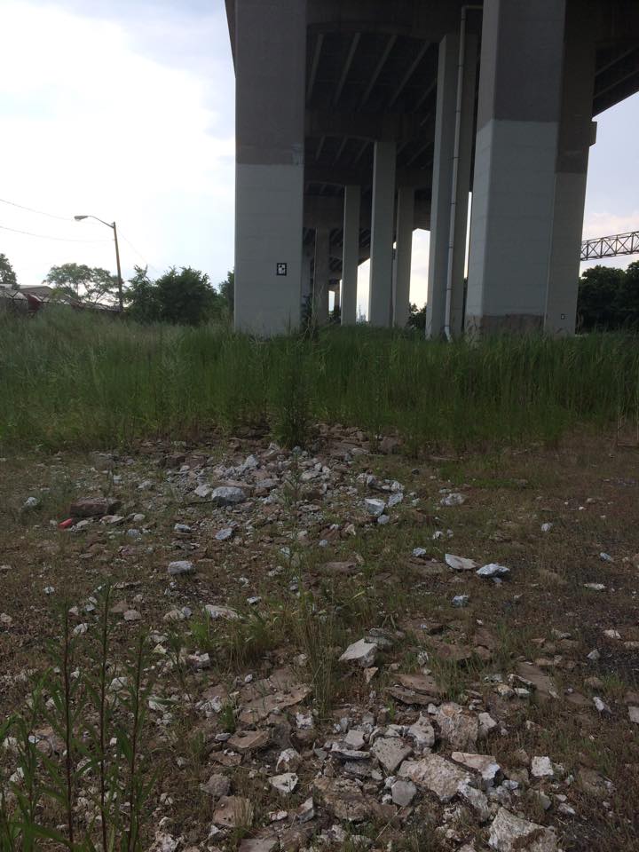 Debris is scattered below the bridge. Photo by Mark Hall. 