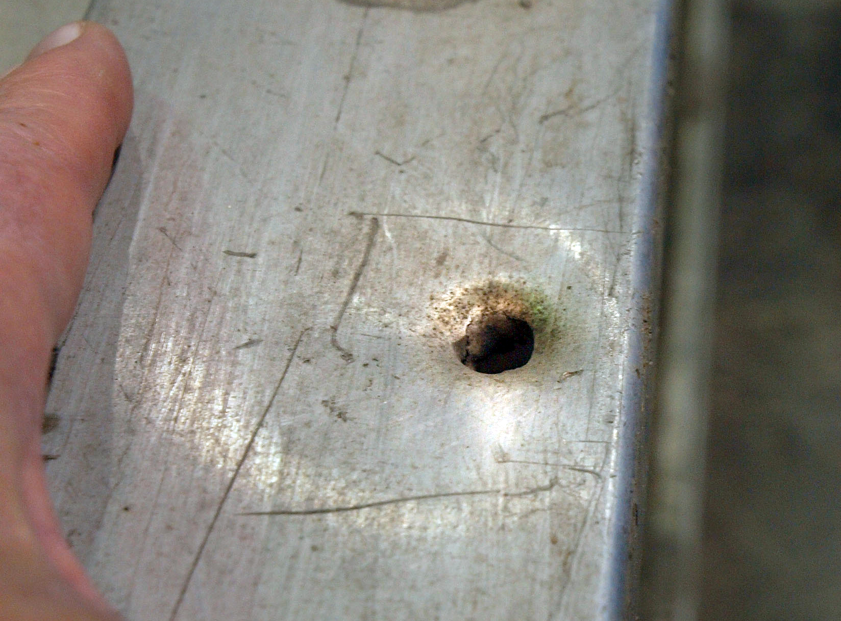 Bullet hole found on a ground ladder for Detroit firefighters. By Steve Neavling. 
