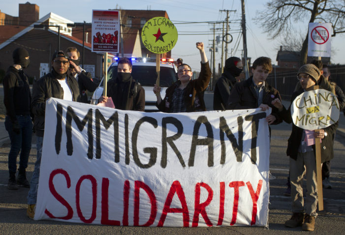 13 photos of pro-immigration rally outside a Detroit ICE office