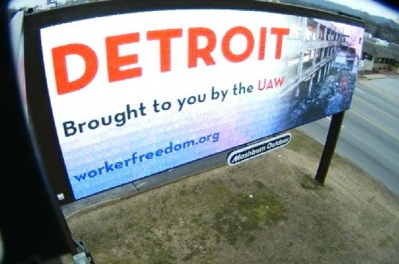 Billboards depict Detroit as industrial wasteland ruined by UAW