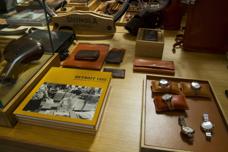 Watches, leather goods and books are on display. 