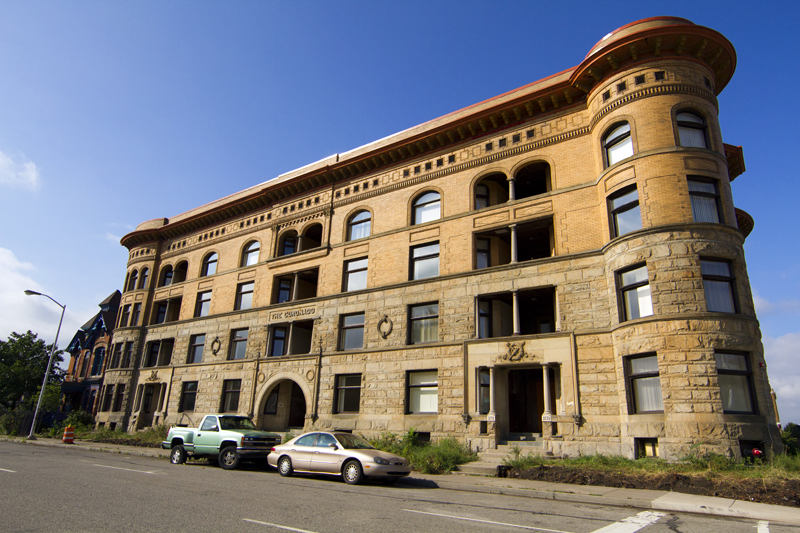 The Coronado was built in the 1890s for the affluent middle class. The Richardsonian Romanesque building now serves low-income residents. 