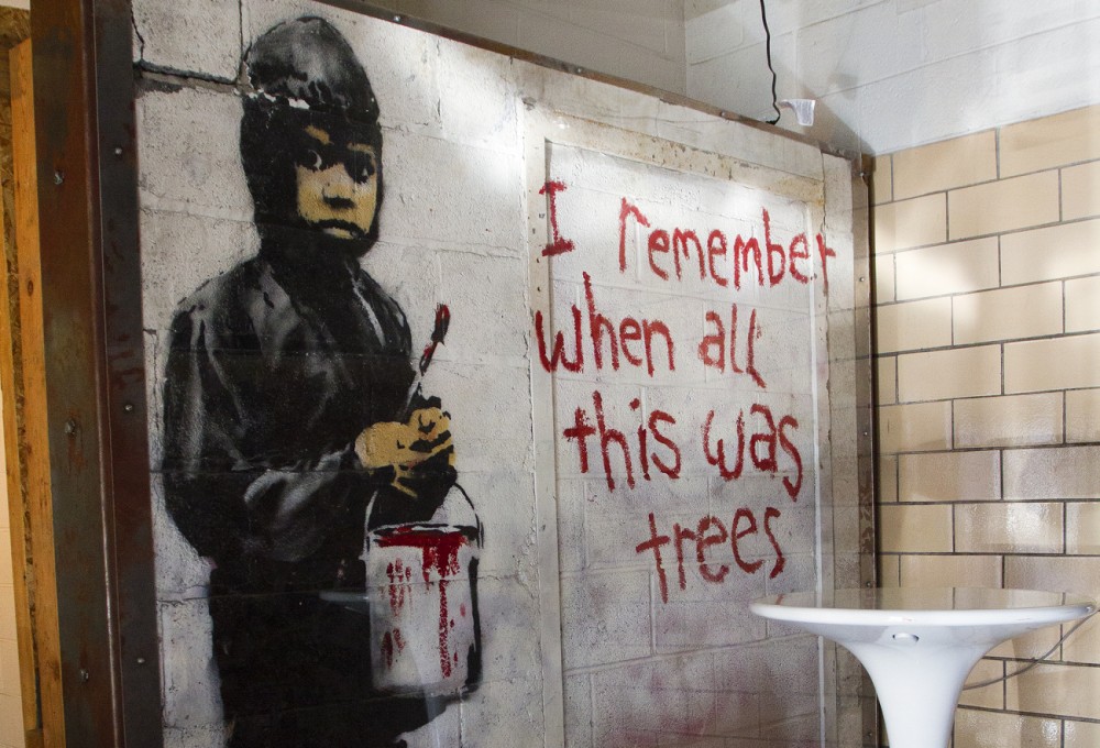 Banksy mural at 555 Gallery. By Steve Neavling. 