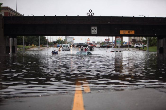 Flooding submerges dozens of cars, closes highways, impedes firefighters in Detroit
