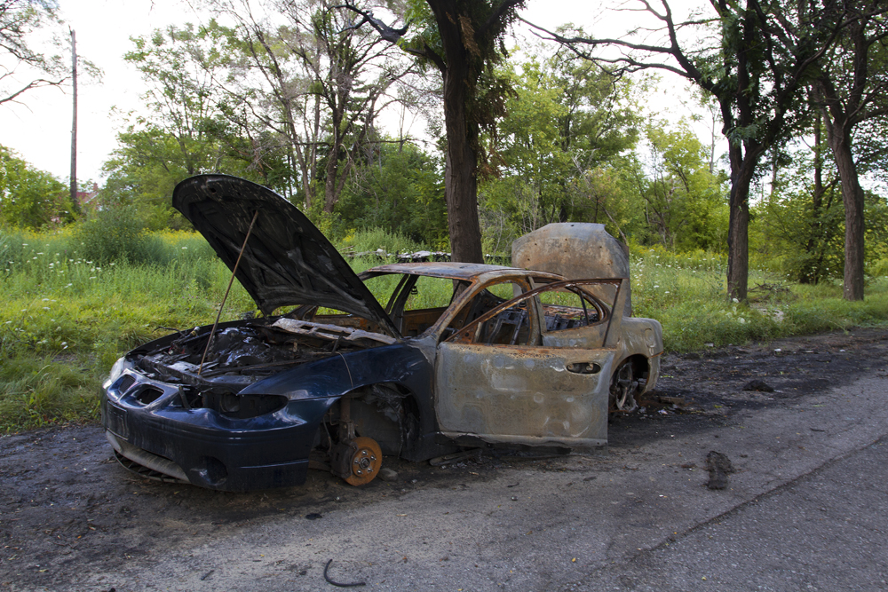 The city has let this burned car for the scrappers. 