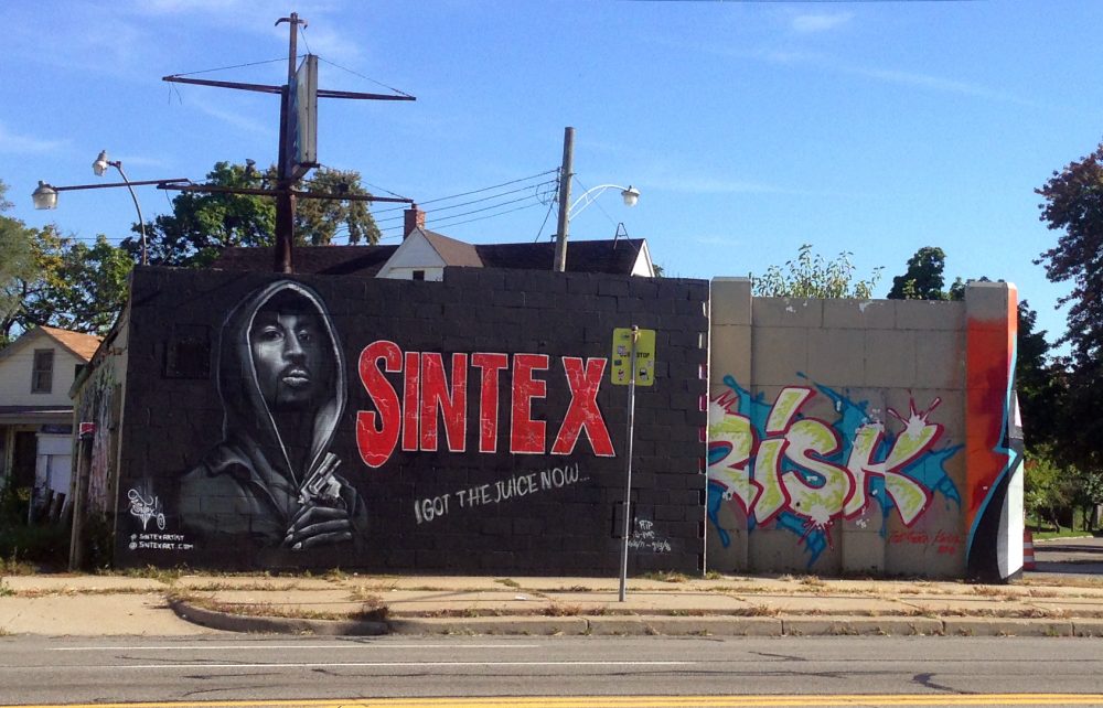 Detroit artist Sintex painted this image of Tupac over a mural by LA artist Revok. 