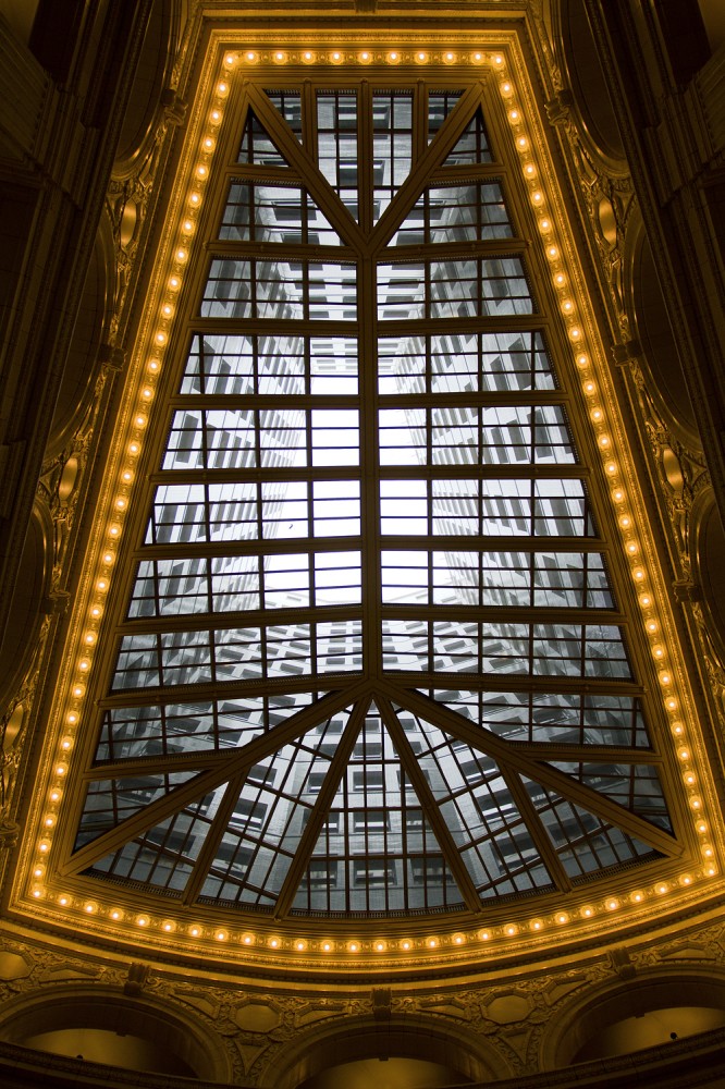 The lobby is covered by a dramatic skylight. 
