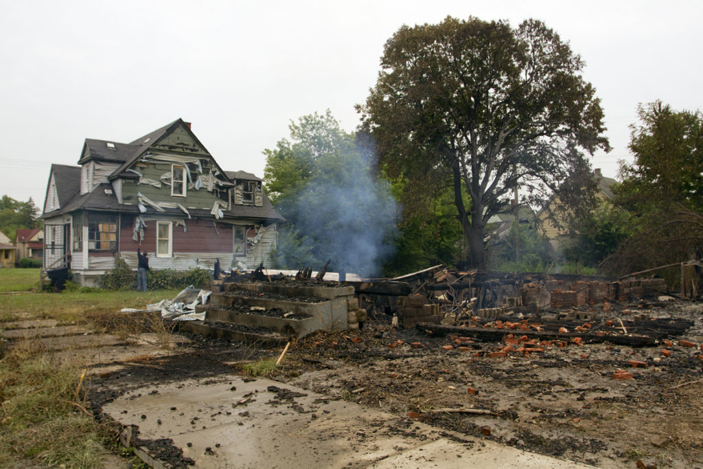 A fire flattened a house on Cutler and damaged two occupied homes. Photo by Steve Neavling. 