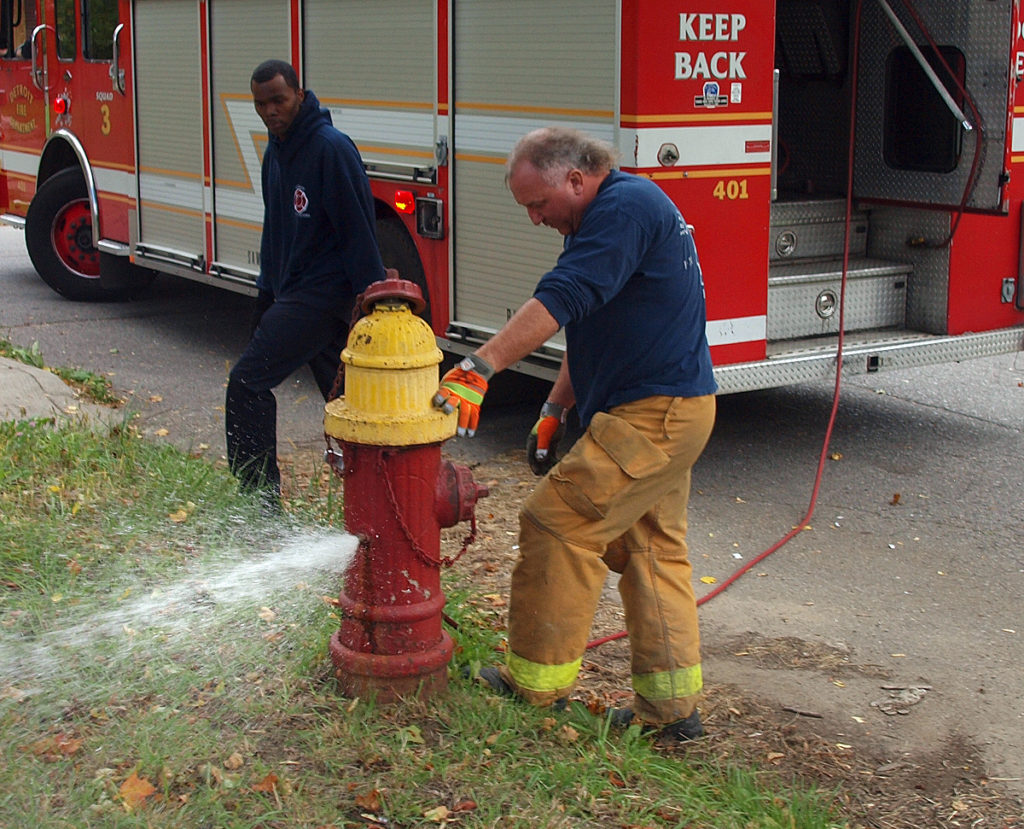 Firefighter Mike Nevin inspects a fire hydrant. Photo courtesy of the Detroit Fire Department. 