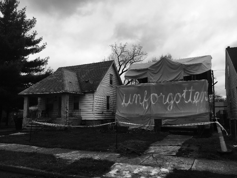 Ryan Mendoza draped the exposed interior with a tarp that read "unforgotten" after his "contractor" failed to demolish the home. 