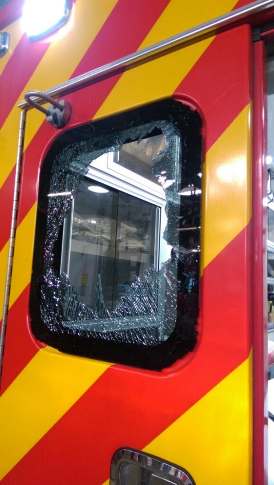 The radio was thrown through this window. Photo courtesy of Detroit Fire Department. 