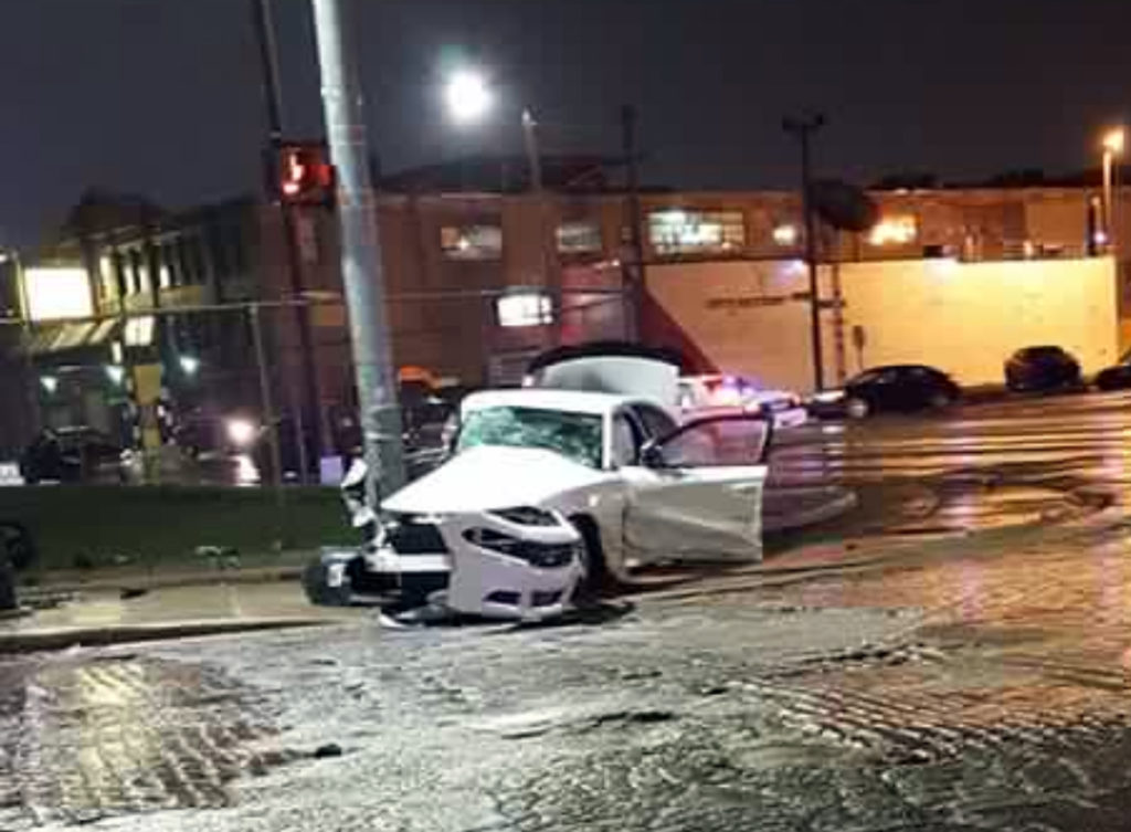 One of the cars crashed into a utility pole around 1 a.m. at the corner of the field. Photo by Craig Wilkins. 