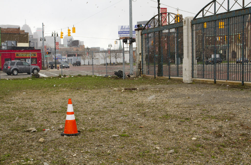 The body of Paul Pesola was flung over an 8-foot fence at the old Tiger Stadium site where the orange cone is. Photo by Steve Neavling. 