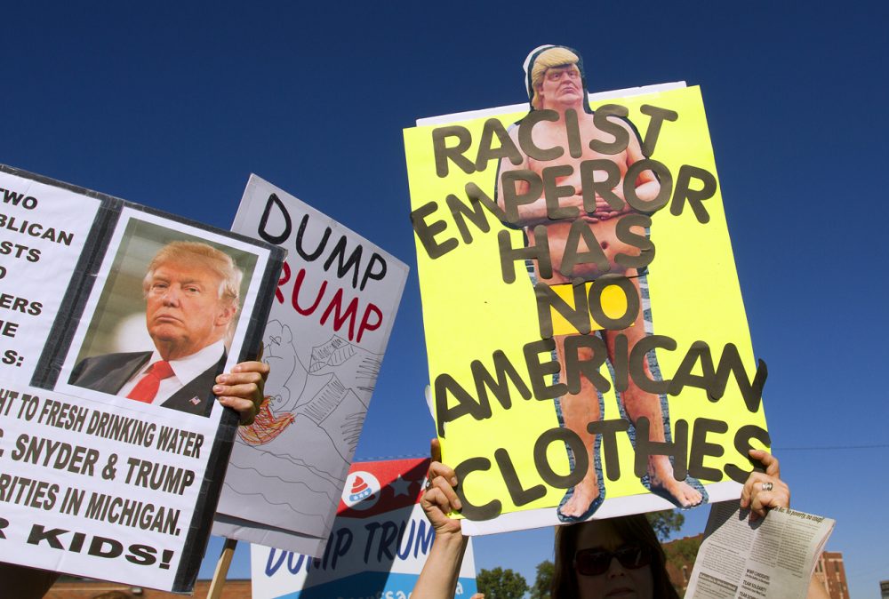 Signs at an anti-Trump rally in Detroit last month. Photos by Steve Neavling. 