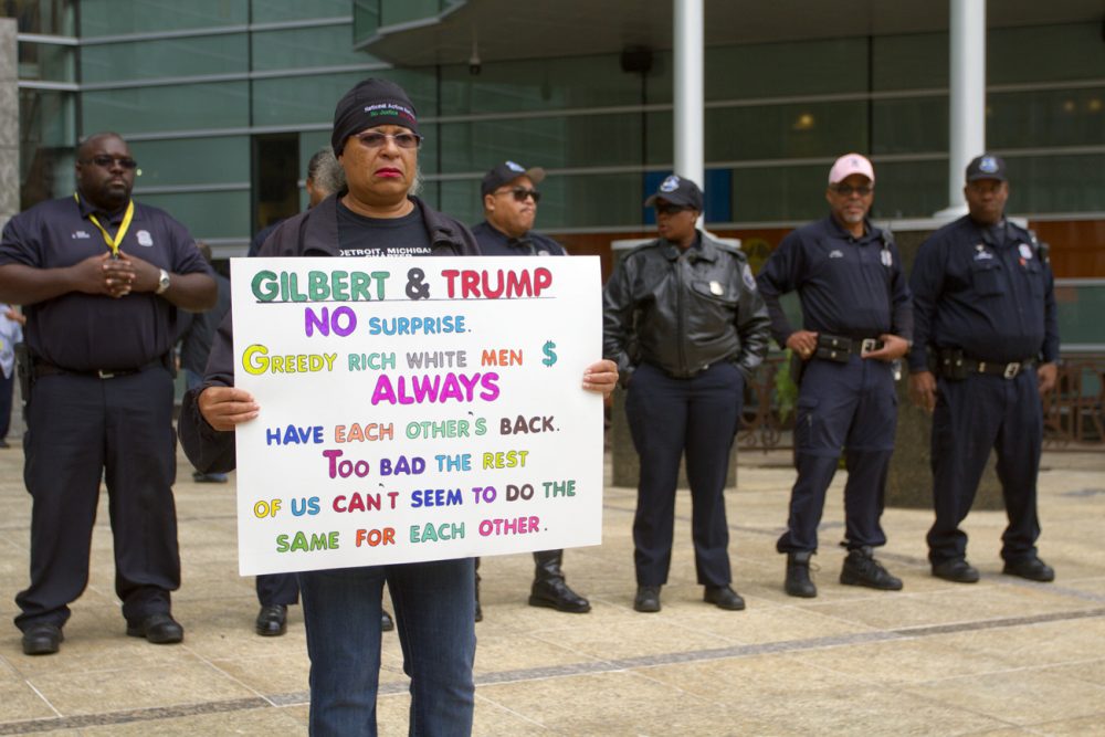 Protesters gathered outside of Dan Gilbert's Quicken Loans headquarters to rally against the fundraiser. 